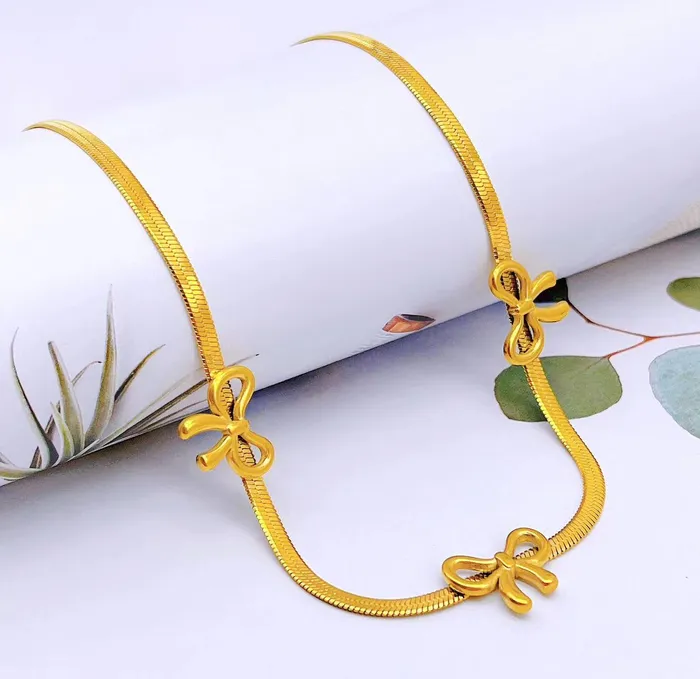 Gold Bow Necklace Upakarna Necklaces
