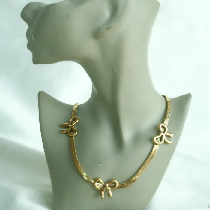 Gold Bow Necklace Upakarna Necklaces